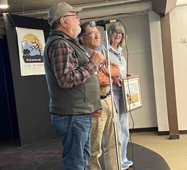 Joe Jessepe (center), a founding member of GTMA and dedicated conservationist, was awarded a Badger-Two Medicine Defender Award.