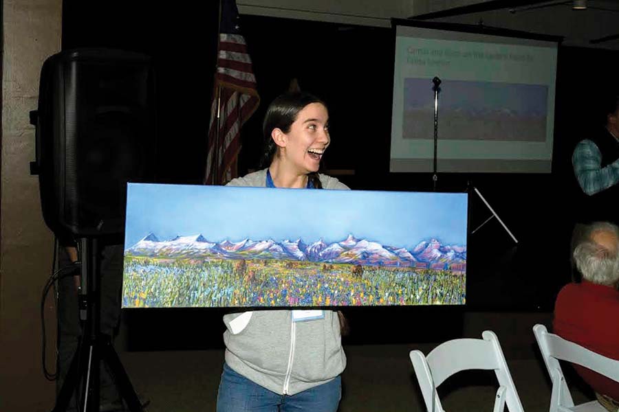 Volunteer Miki Flint was an excellent "Vanna White" at the auction.